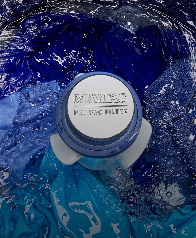A closeup of the Pet Pro Filter on a washing machine.