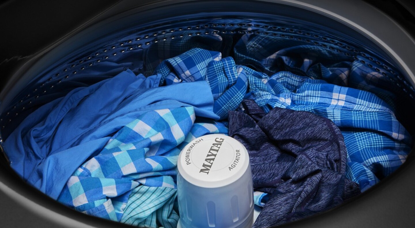 Maytag® washer filled with blue clothes Maytag® washer filled with blue clothes