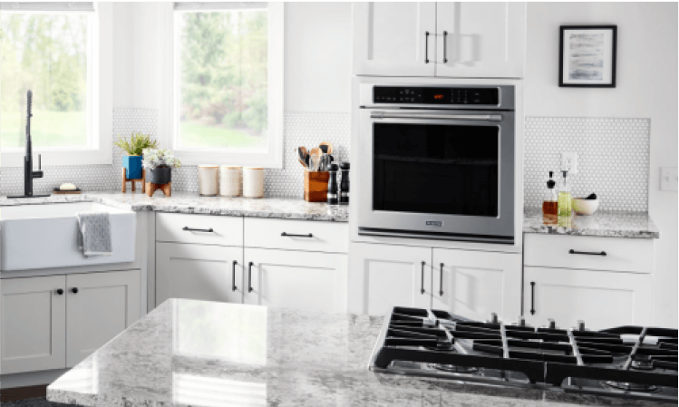 A Maytag® wall oven in a white kitchen