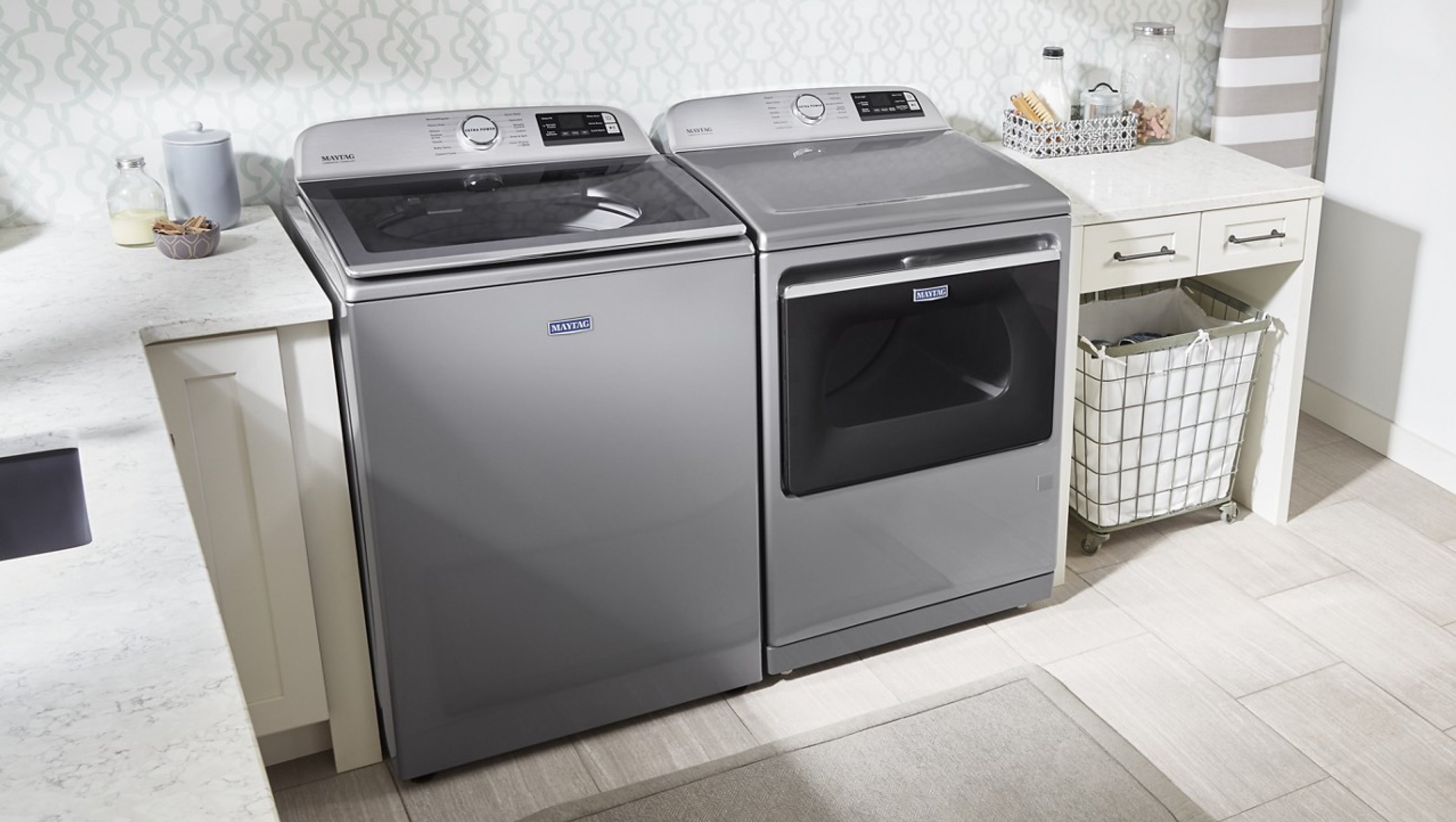 Maytag® top load washer and dryer in a laundry room Maytag® top load washer and dryer in a laundry room