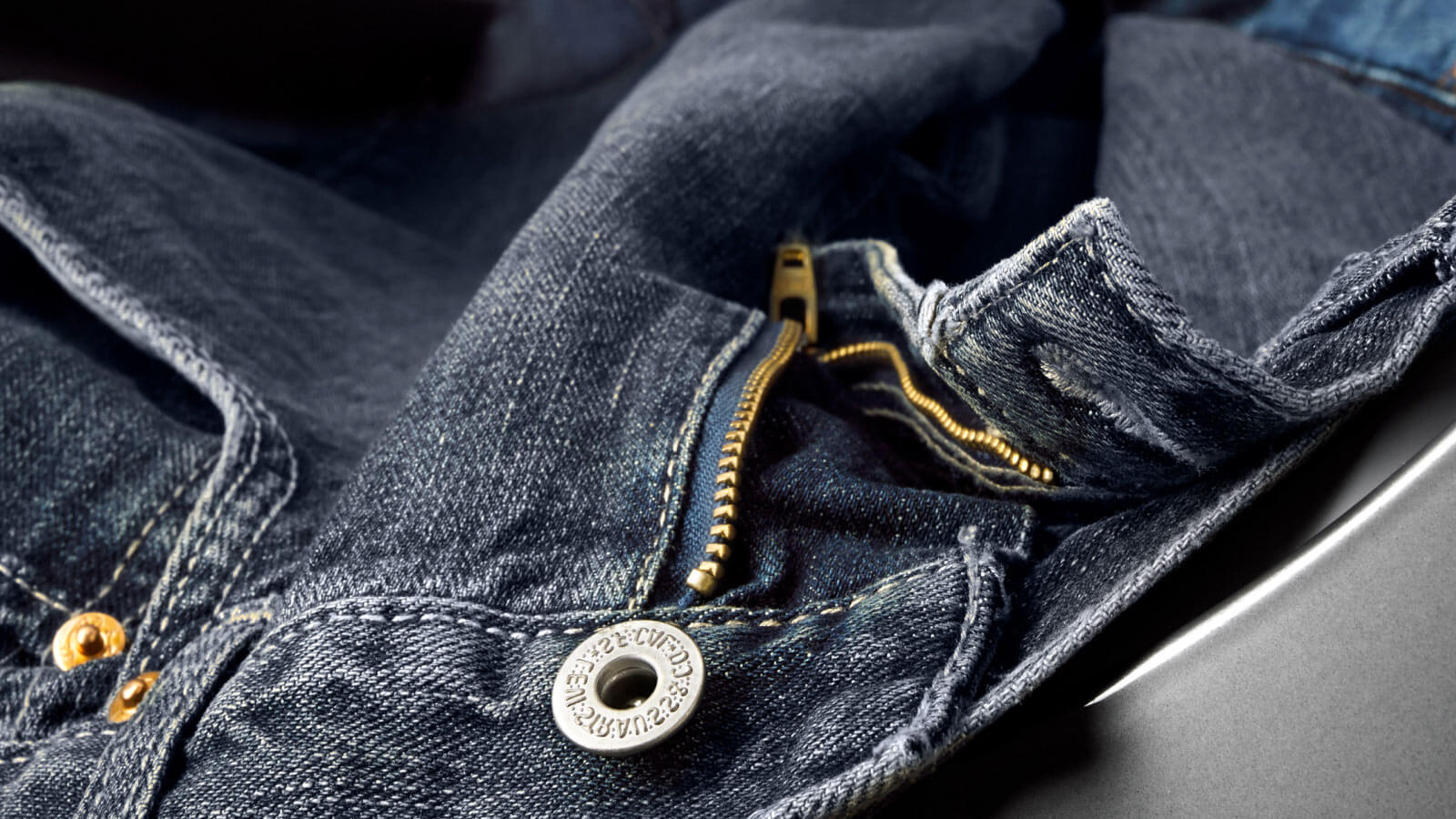 Close up of a pair of denim jeans Close up of a pair of denim jeans