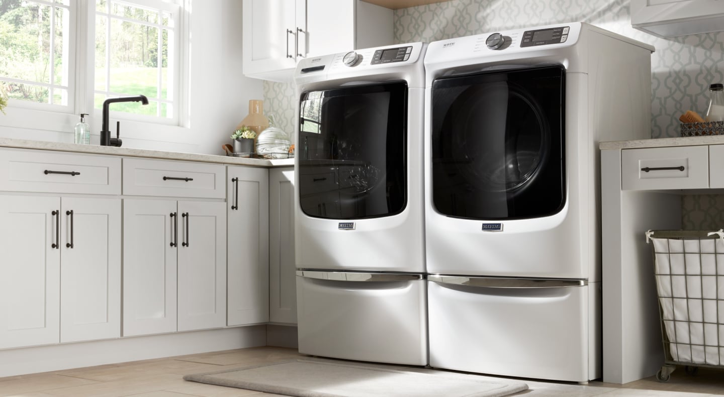 White Maytag® front-load washer and dryer pair.
