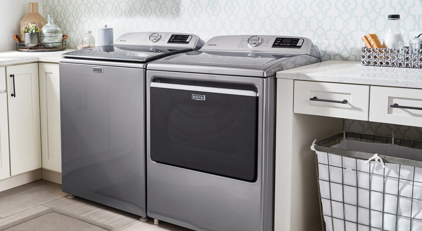 Gray Maytag® top-load washer and dryer pair.
