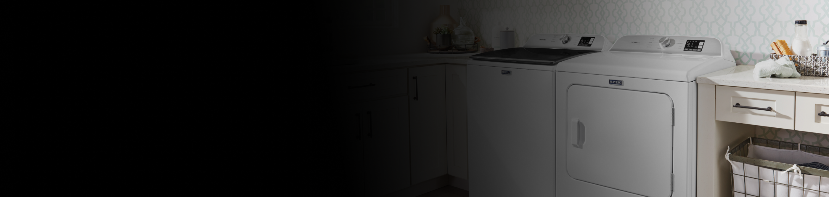 Laundry room with a white Maytag® washer and dryer