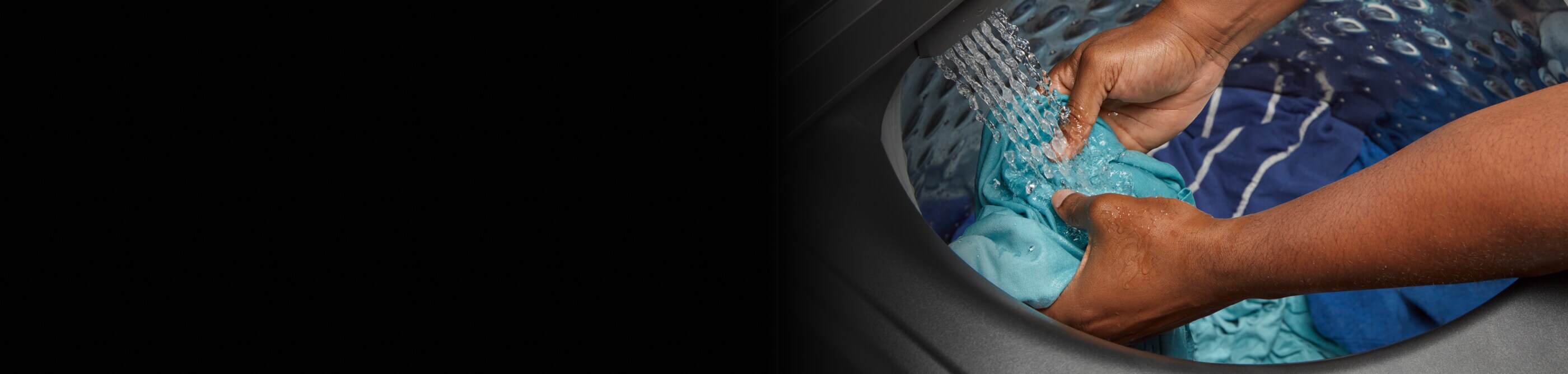 Person washing a garment in their washer’s  built-in sink