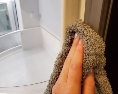 Wiping down a fridge seal