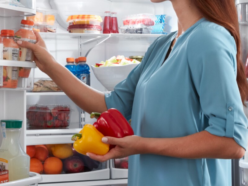Removing items from a fully stocked refrigerator Removing items from a fully stocked refrigerator