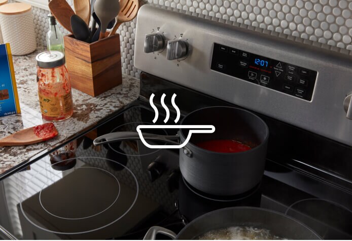 Sauce warming on the warming center of a Maytag® range.