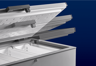 The lid of a Maytag® chest freezer in motion.
