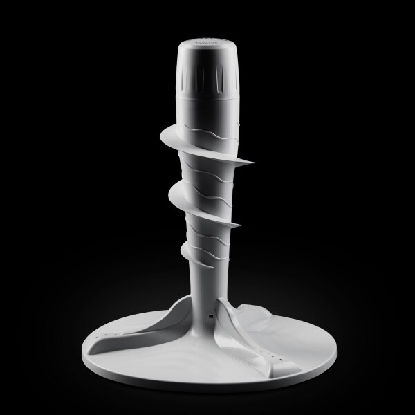 Top load washer agitator against black background