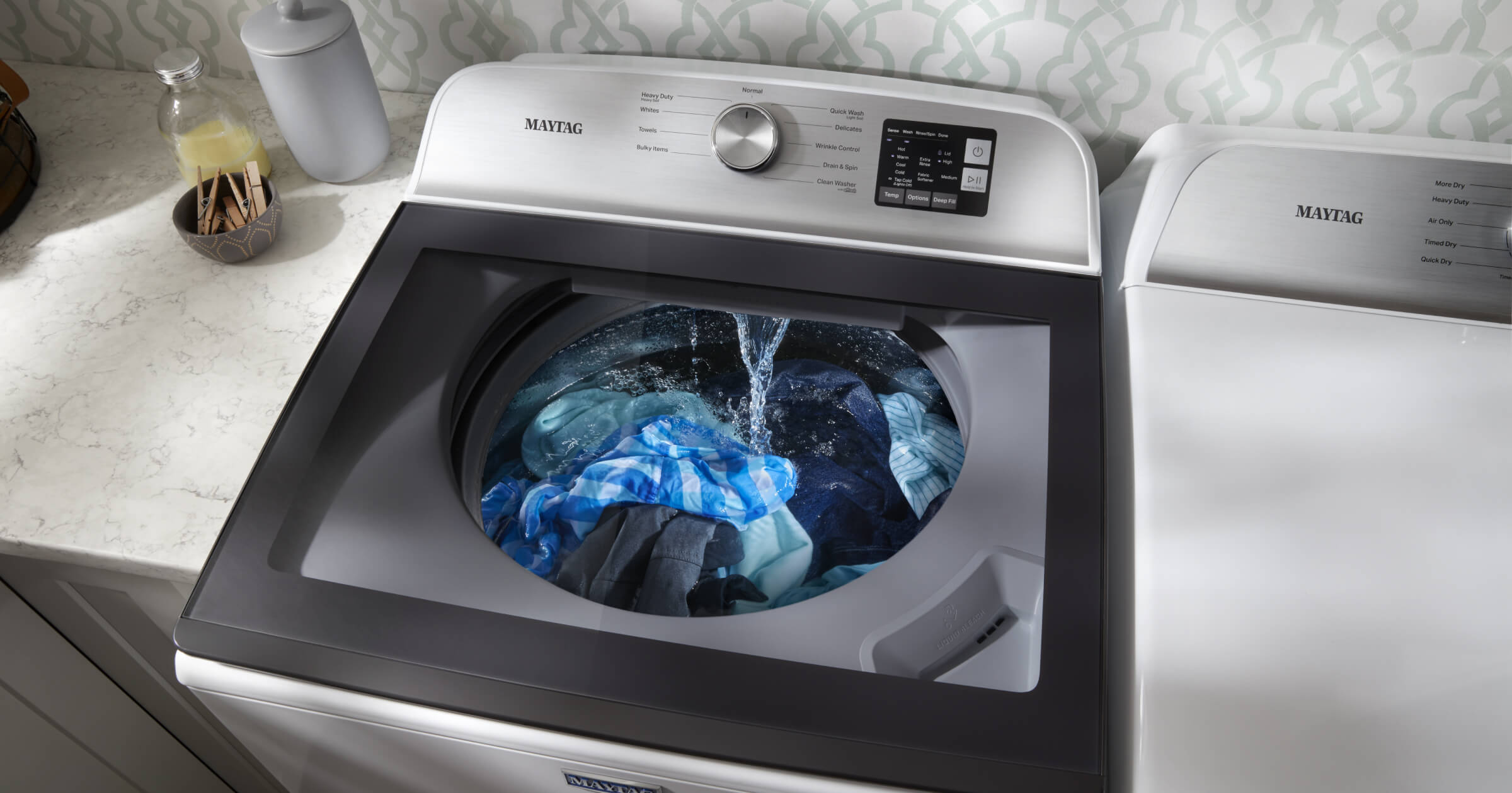 Water running on clothing in a washing machine Water running on clothing in a washing machine