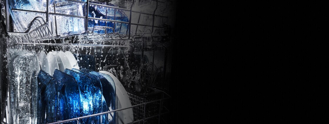 Dishes being cleaned inside a dishwasher