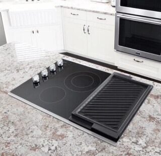 A cooktop on a kitchen island