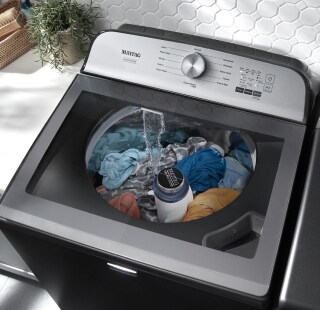 Top load washing machine during a wash cycle