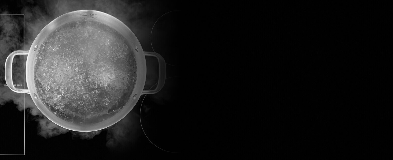 Water boiling in a pot on a cooktop