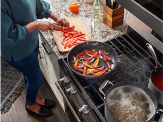 Person cooking on a gas range