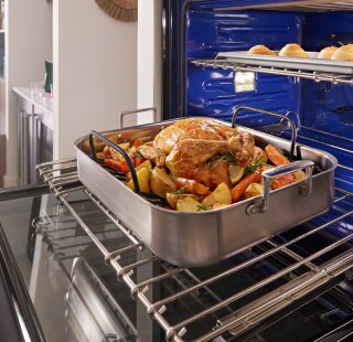 A chicken roasting in an oven