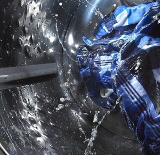 A closeup of the inside of a washer in action