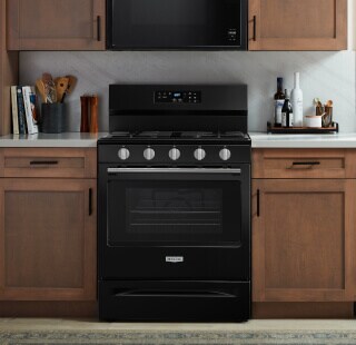 A Maytag® range and microwave in a kitchen