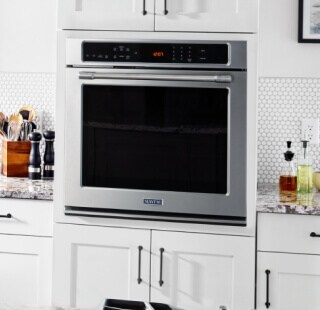 Wall oven in a white kitchen