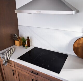 An induction cooktop on a white countertop