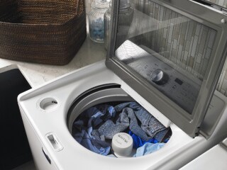 Laundry soaking in a Maytag® washer