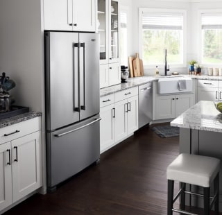 A modern kitchen with white cabinetry
