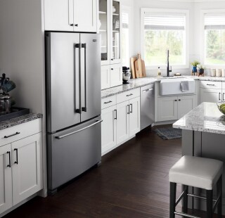 A modern kitchen with white cabinetry
