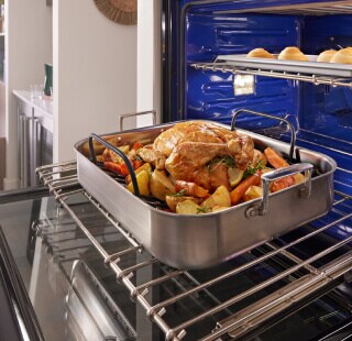 A tray of roasted turkey and vegetables