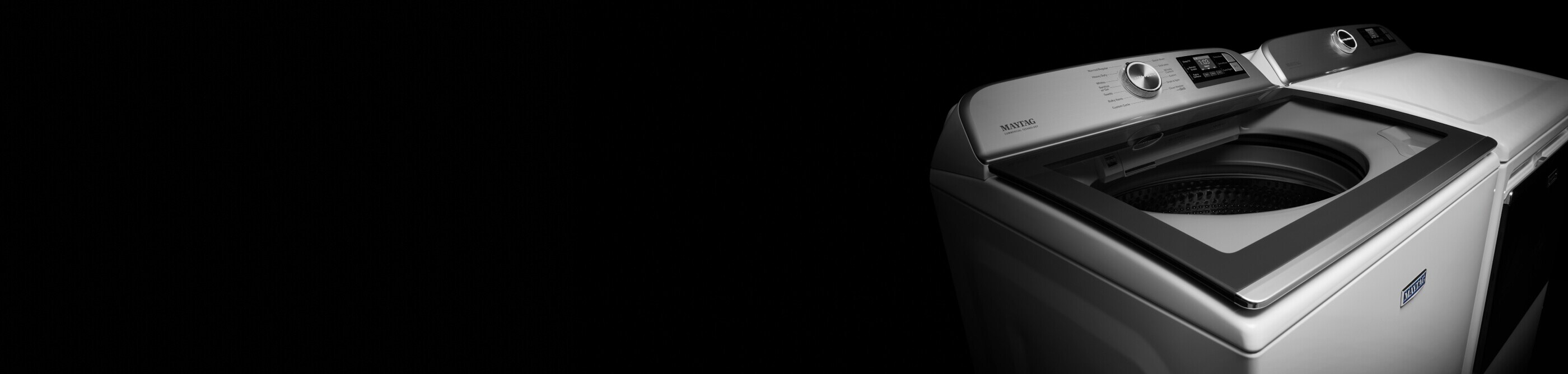 A white Maytag® top load washer and dryer