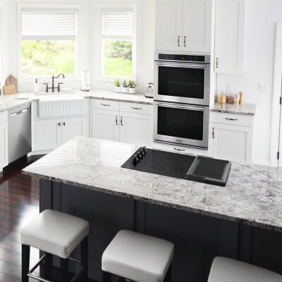 A Maytag® electric cooktop in a modern kitchen