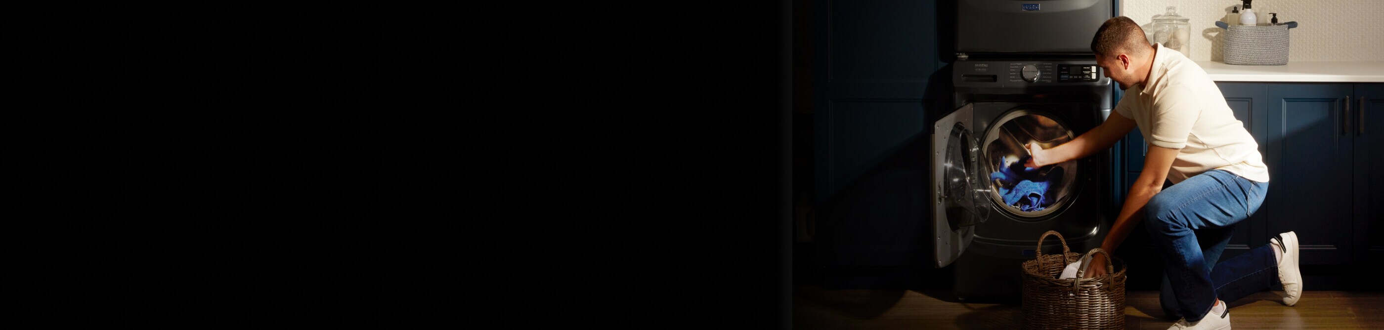 A person taking clothes out of their dryer