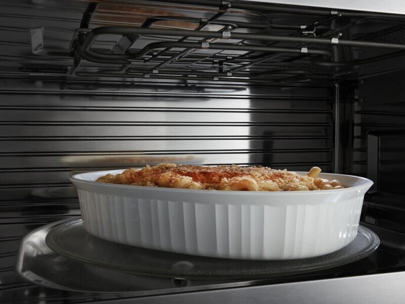 A closeup of the interior of a convection Maytag® microwave cooking a pasta meal A closeup of the interior of a convection Maytag® microwave cooking a pasta meal