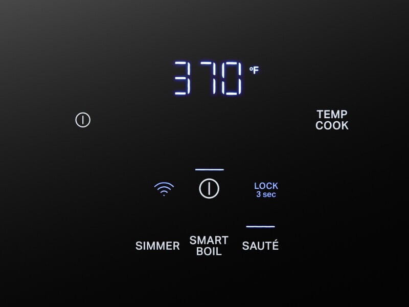 Close-up of touch controls on an induction cooktop