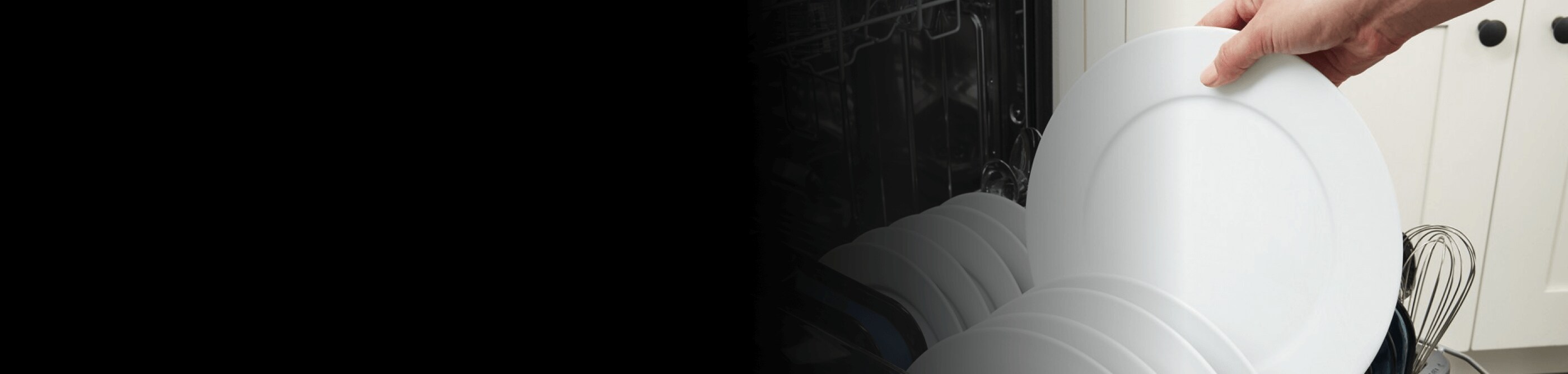 Person loading dishes into a dishwasher