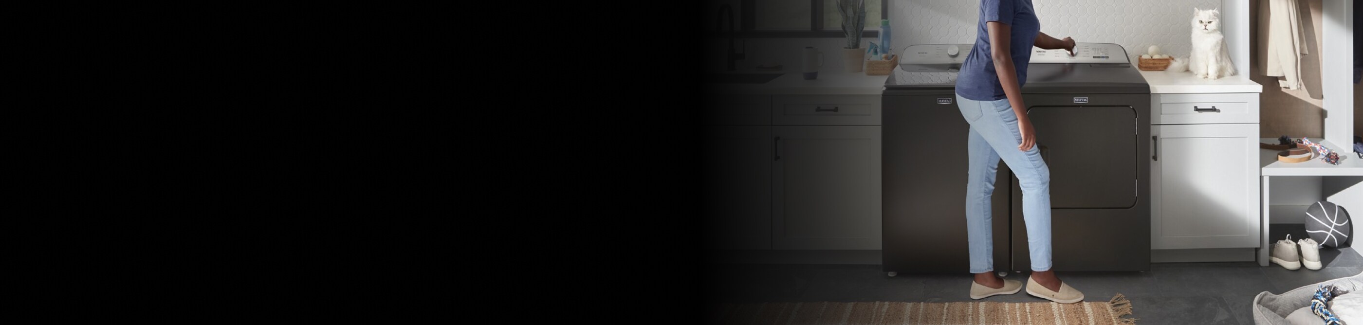 Person standing at a washing machine