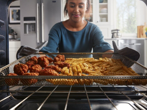 Person removing food from an oven