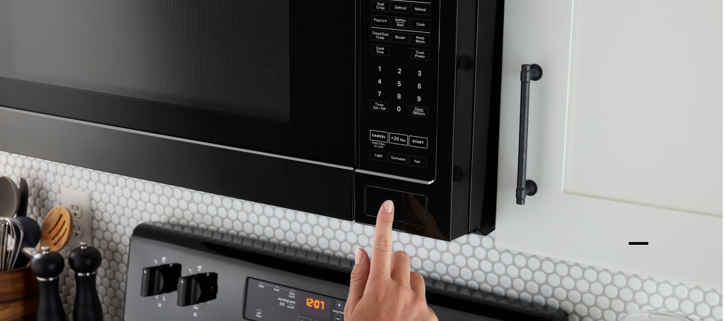 Black Maytag® refrigerator in a white kitchen