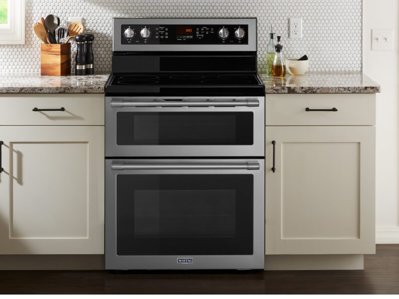 Maytag® double oven in between white cabinetry Maytag® double oven in between white cabinetry
