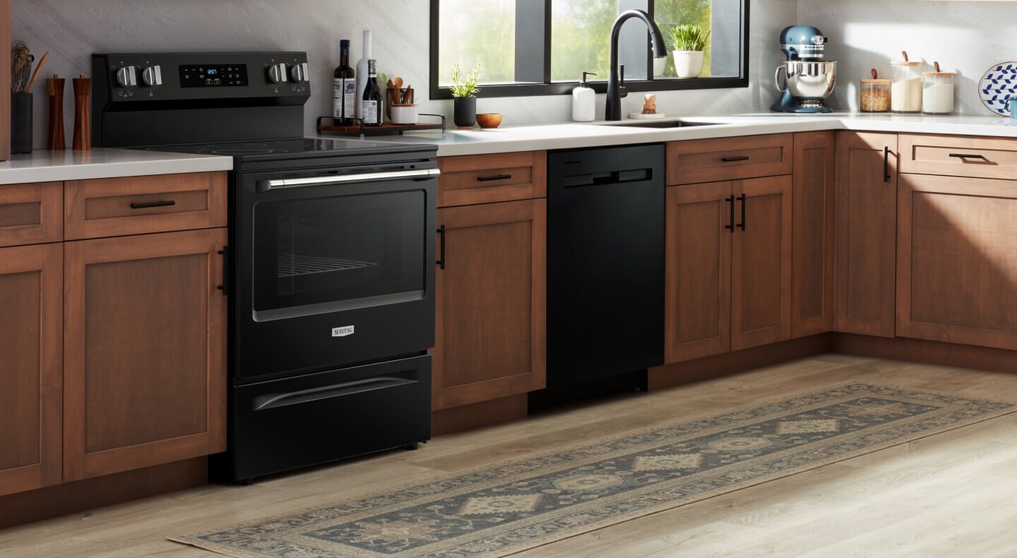Black electric range in a rustic kitchen