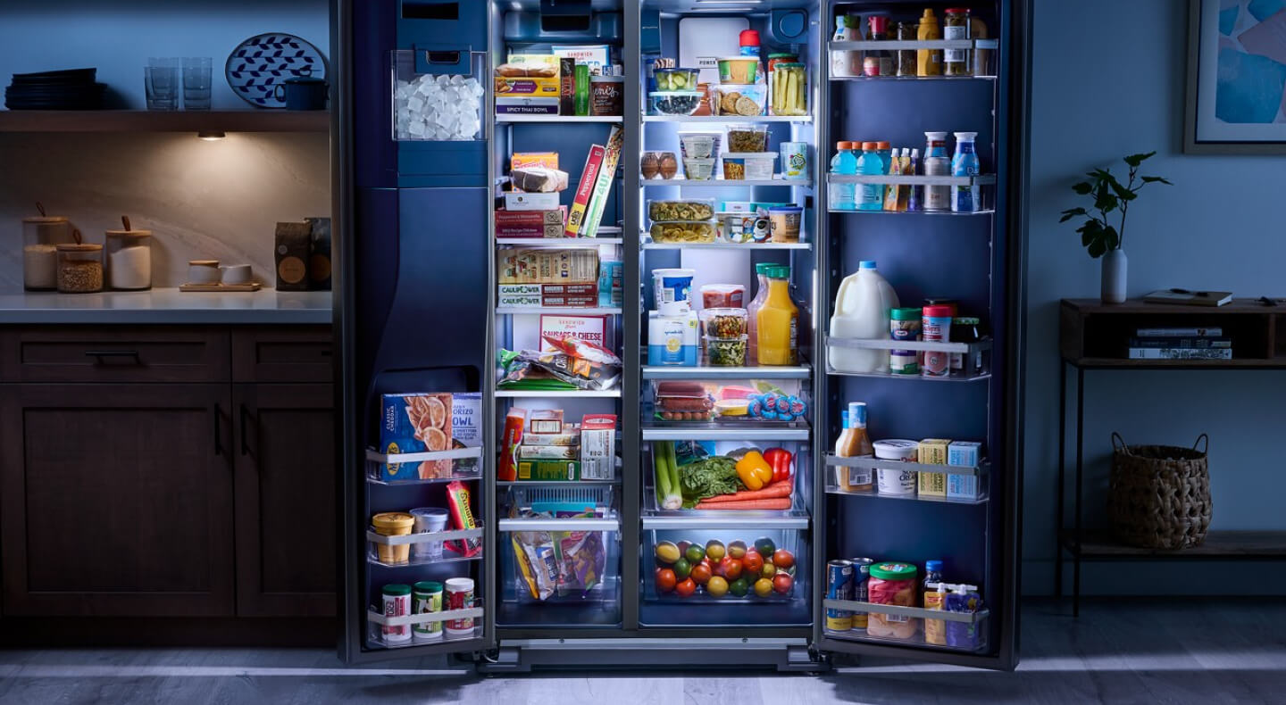Open side-by-side refrigerator filled with food