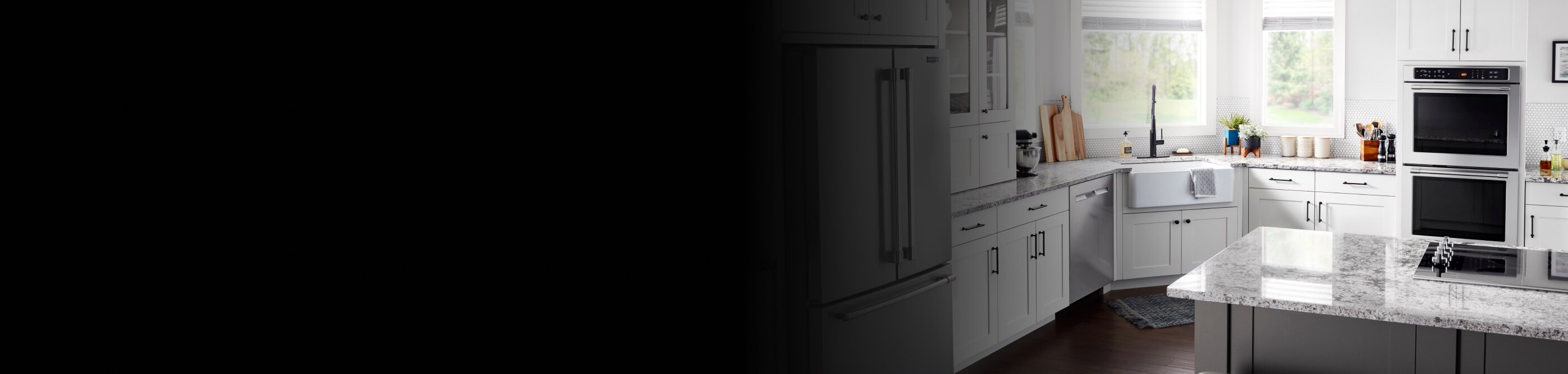 A Maytag® Double Wall Oven and cooktop in a modern kitchen