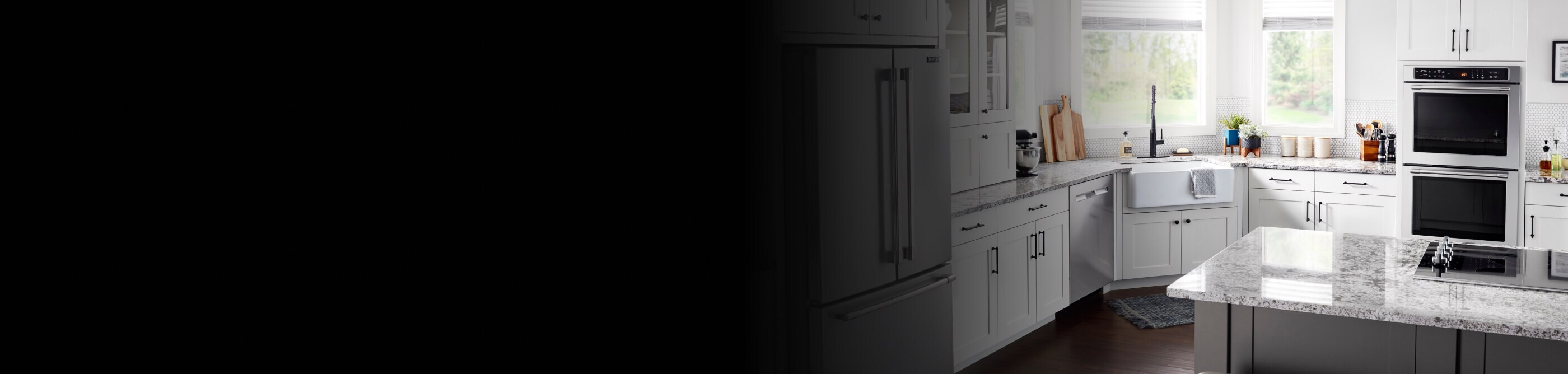 A Maytag® Double Wall Oven and cooktop in a modern kitchen