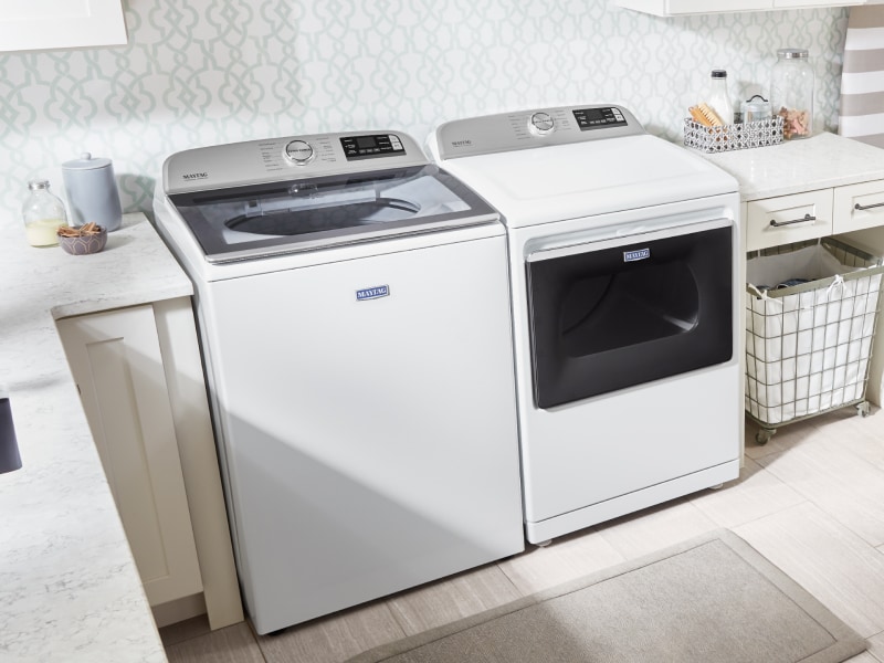 White Maytag® washer and dryer in a laundry room White Maytag® washer and dryer in a laundry room