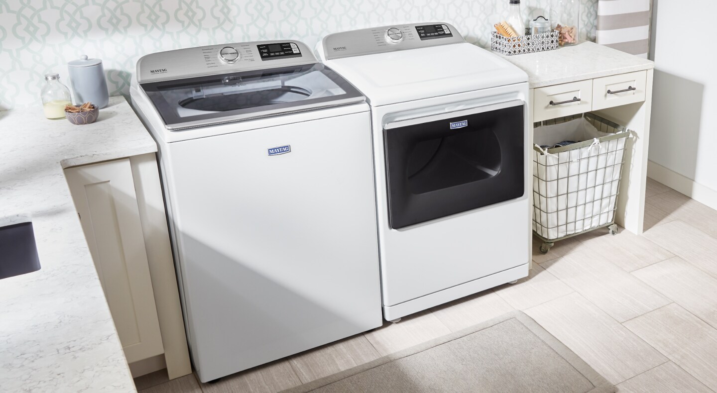 White Maytag® washer and dryer in a laundry room White Maytag® washer and dryer in a laundry room