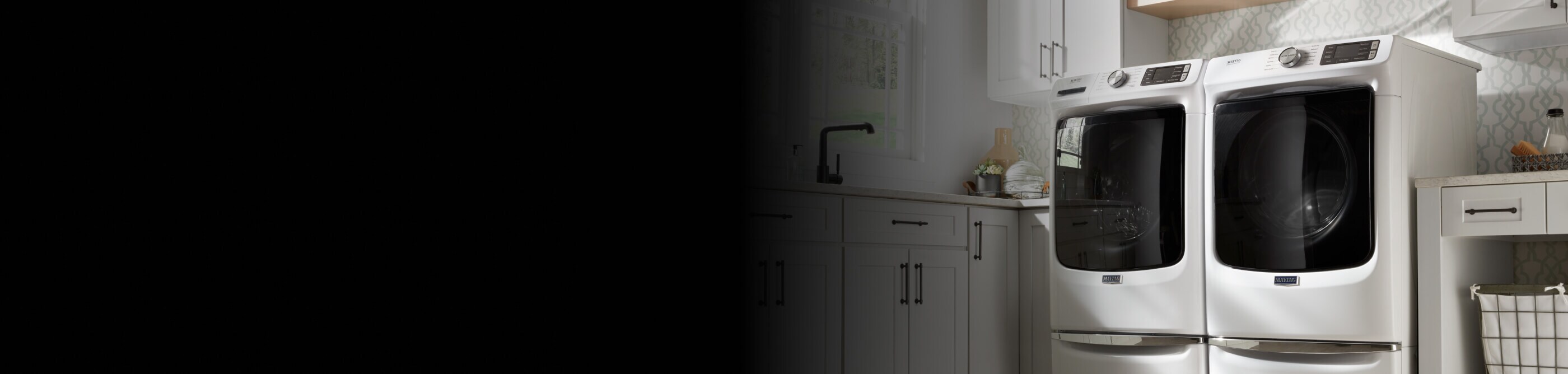 A white, front-load Maytag® washer and dryer set