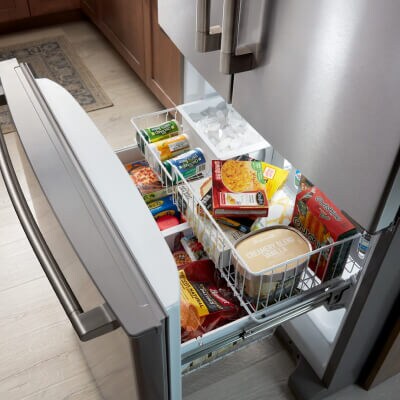 Open freezer compartment in a Maytag bottom-freezer refrigerator