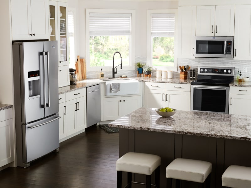 Kitchen with dishwasher and other appliances Kitchen with dishwasher and other appliances