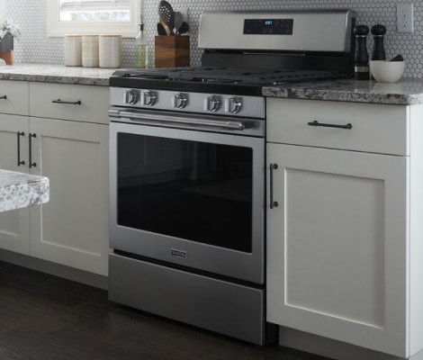 Maytag® range in a white kitchen