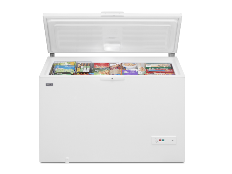 An opened white Maytag® chest freezer. An opened white Maytag® chest freezer.